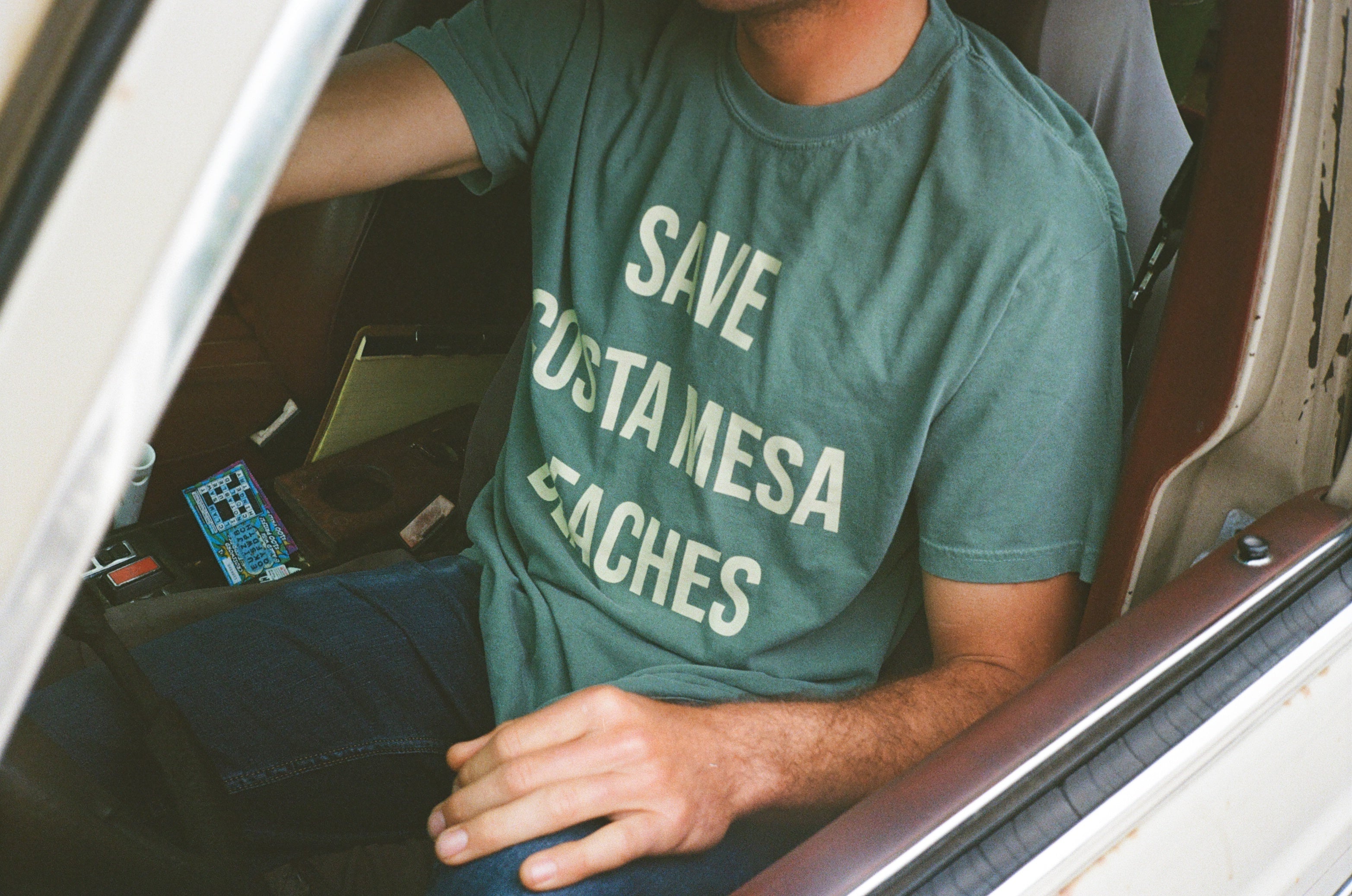 CMSC Shirt worn by someone sitting in a car
