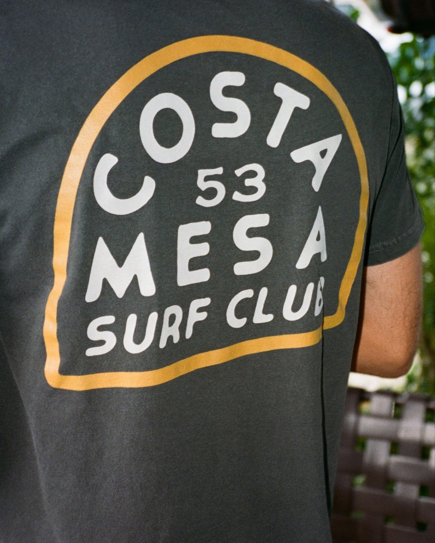 Black t-shirt with 'Costa Mesa Surf Club' text on the back
